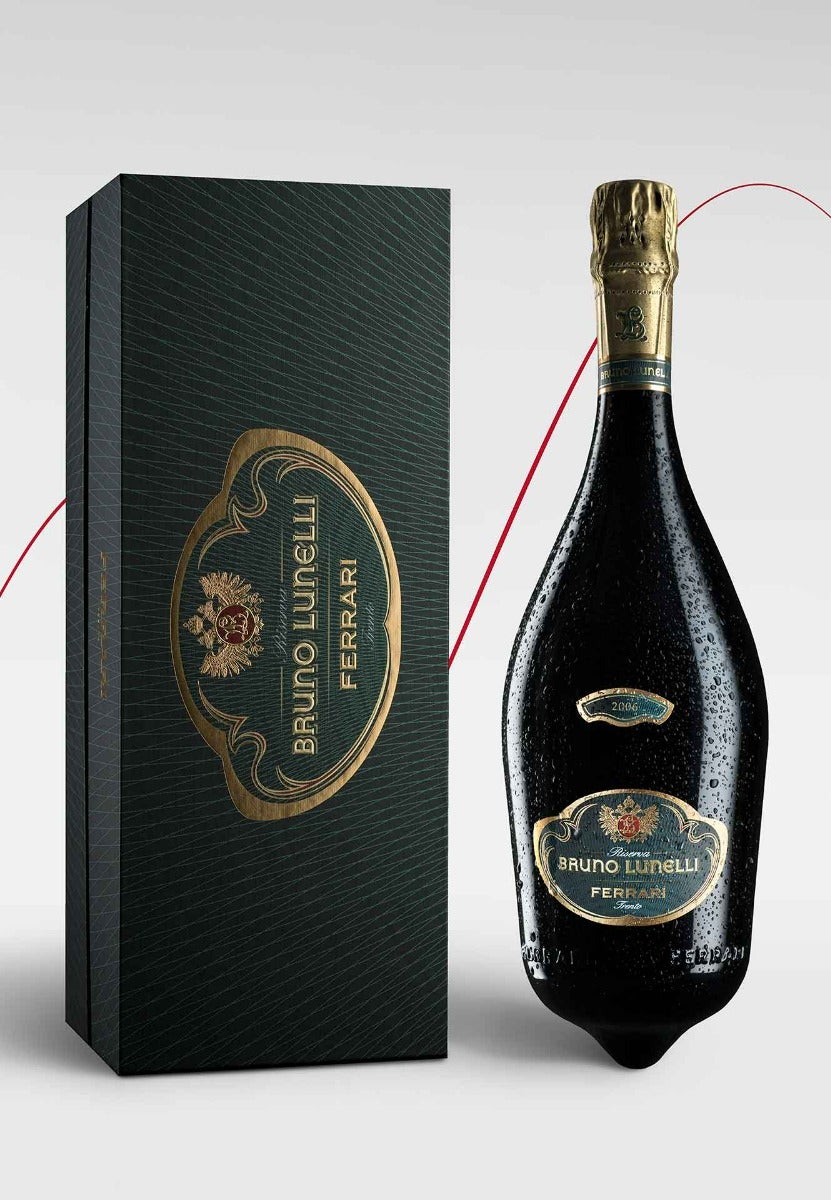 https://www.enotecalunelli.com/media/catalog/product/f/e/ferrari-brunolunelli-2006_astuccio-verticale_bottiglia-bagnata_03.jpg